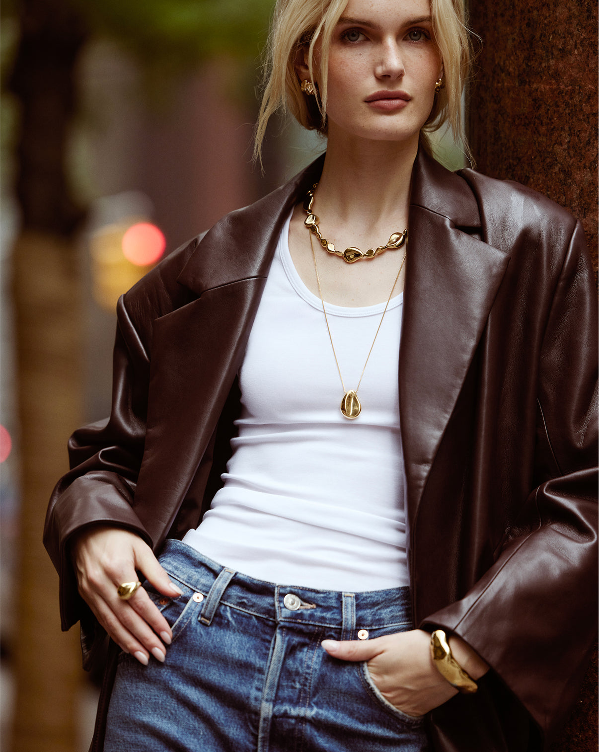 Model wearing the Forma Toggle Clasp Necklace, displaying how it sits elegantly on the neckline