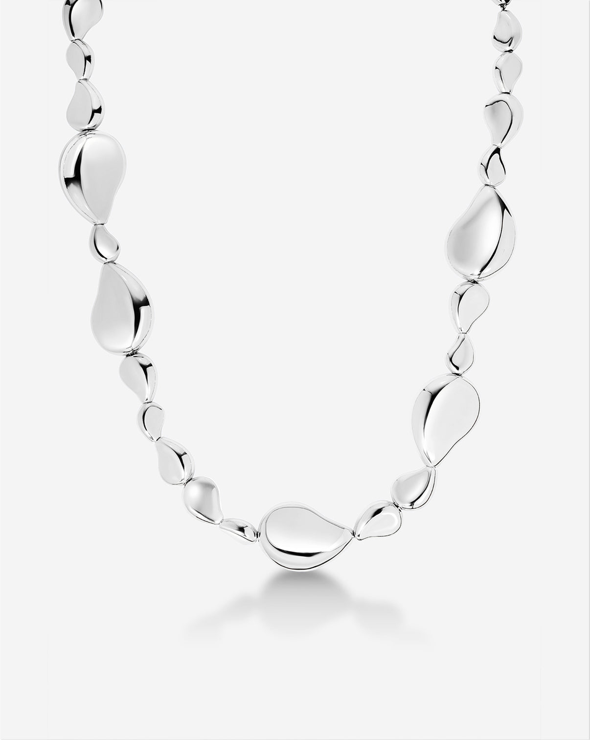 Flat lay styling of the Forma Toggle Clasp Necklace showing the full length and toggle clasp detail