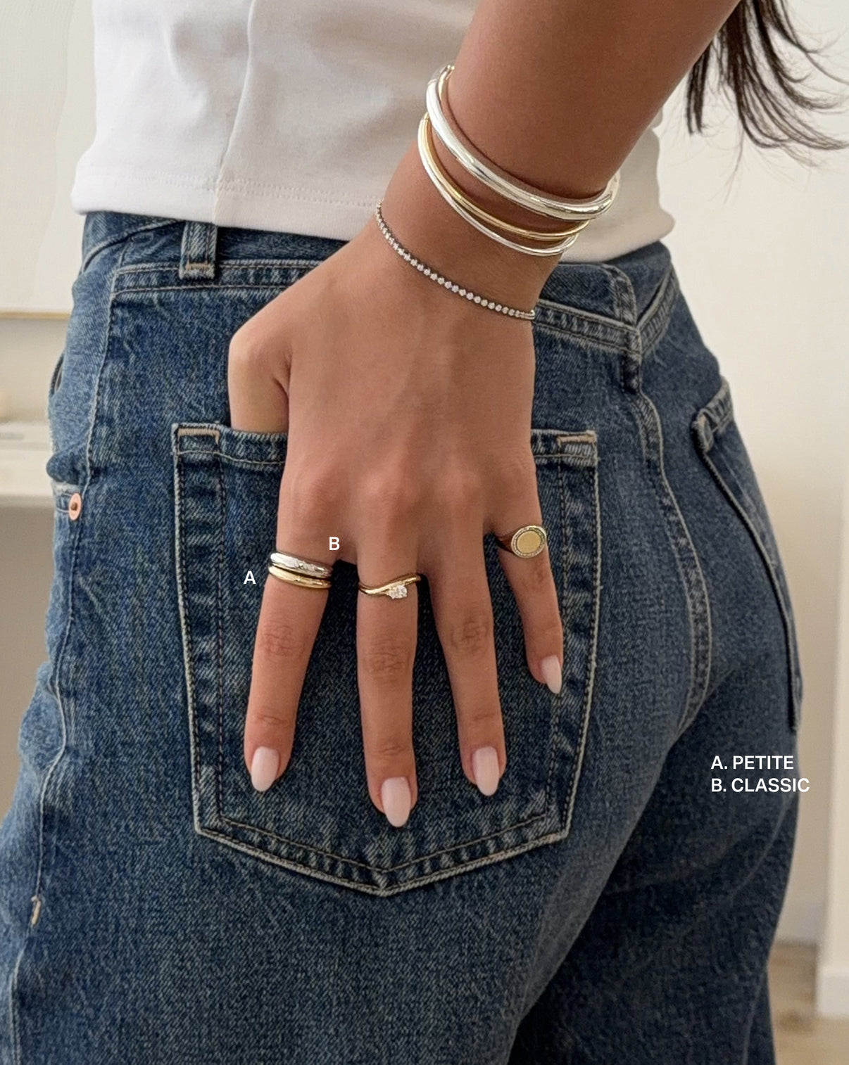 Lifestyle shot comparing the petite and classic width options for the cloud ring in 14k white gold and sterling silver