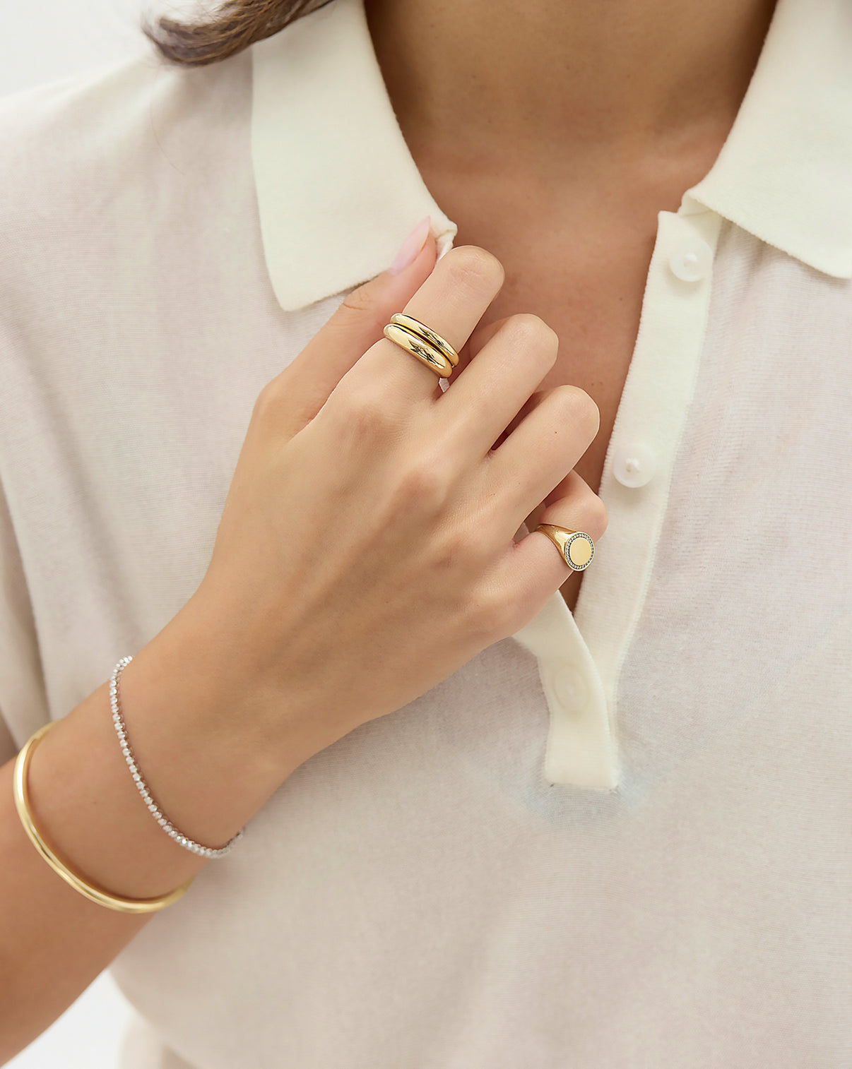 Cloud Ring in petite and classic shown on model's finger with a signet pinky ring