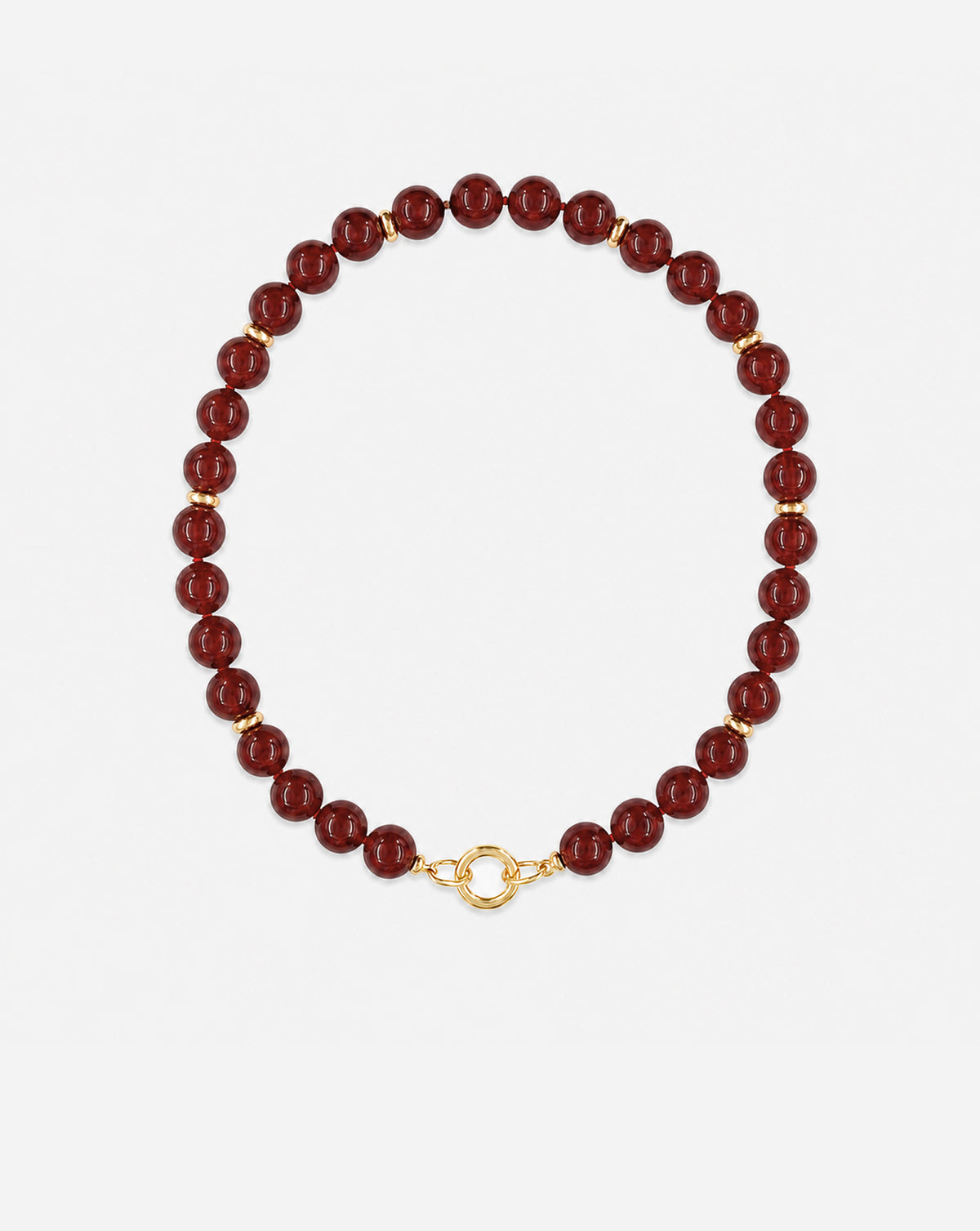 A beaded necklace made of glossy dark red round beads separated by small gold spacer beads, finished with a gold ring clasp, shown on a light gray background.