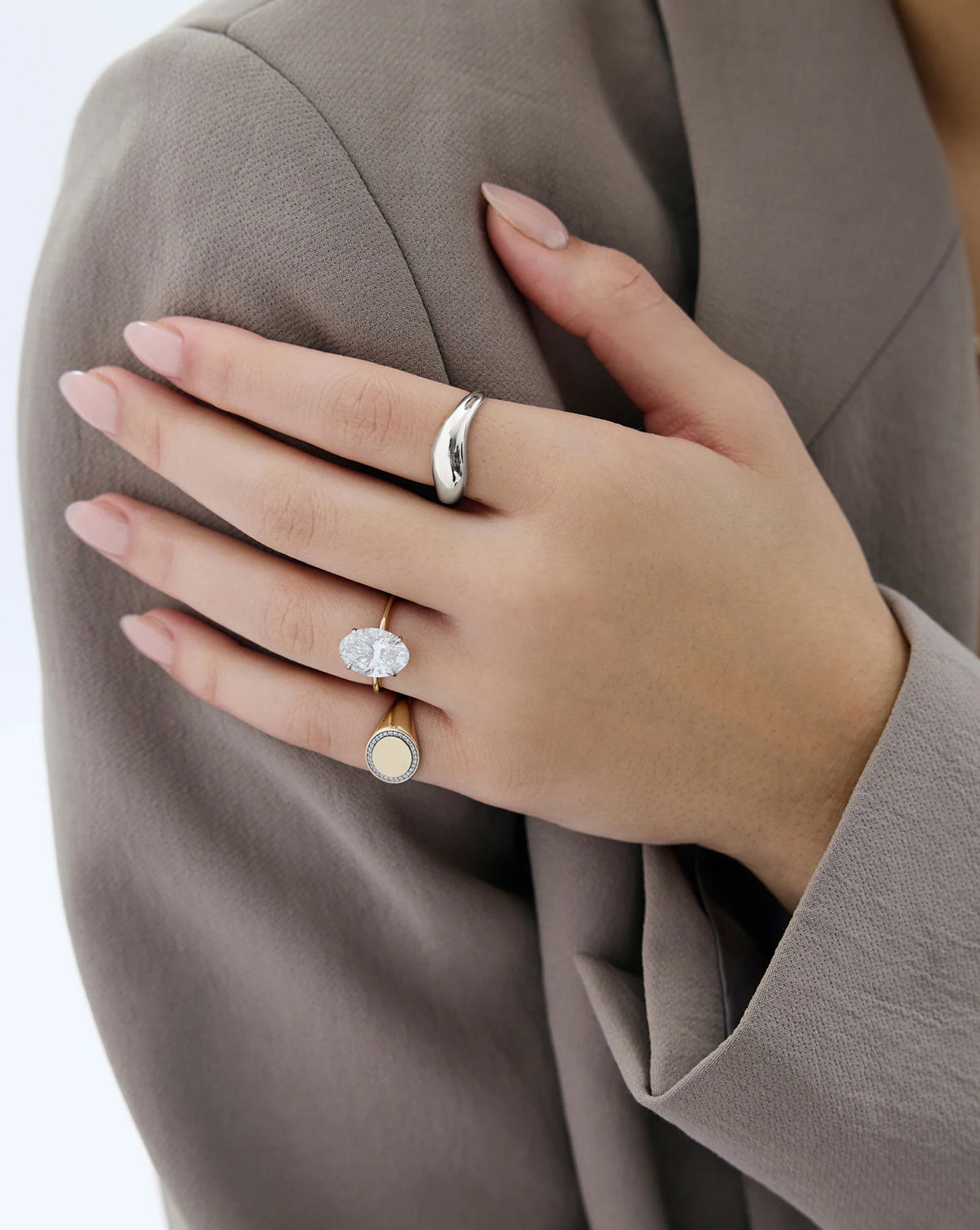 Movement Cloud Ring in Sterling Silver on model styled with some of our other favorite rings 14k white gold