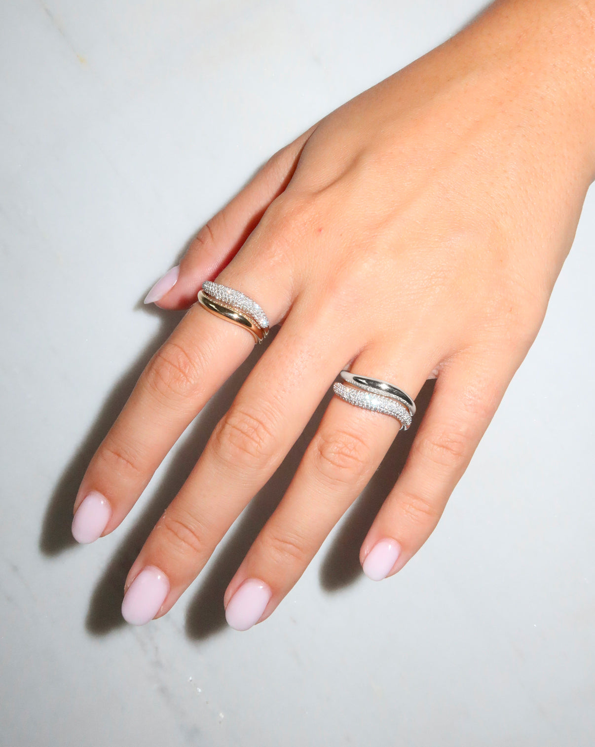 Model wearing our Movement Cloud Rings in Sterling Silver, 14k white gold, and 14k yellow gold