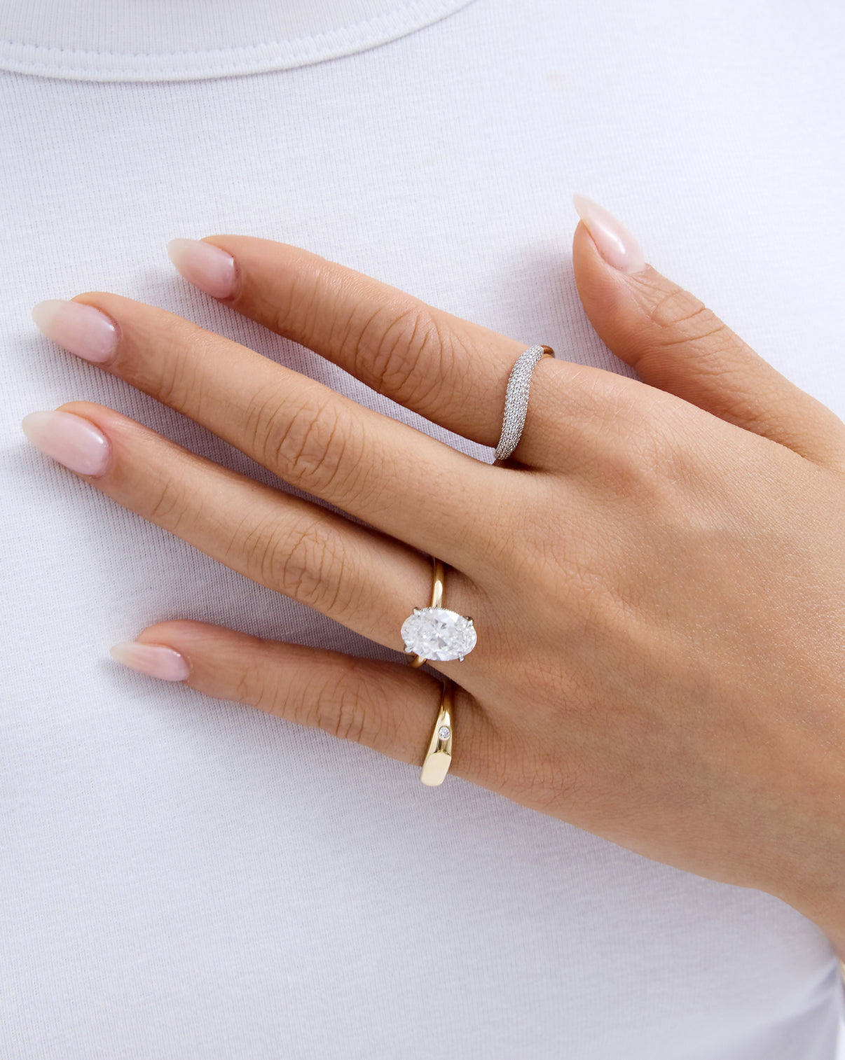 Petite Pavé Movement Cloud Ring in 14K Yellow Gold shown on model styled with engagement ring and pinky ring
14k yellow gold 14k white gold