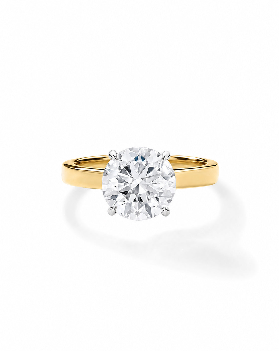 14k Yellow gold engagement ring with a round diamond in a four-prong setting, on a cigar-style band, shown on a white background. 44829996843096