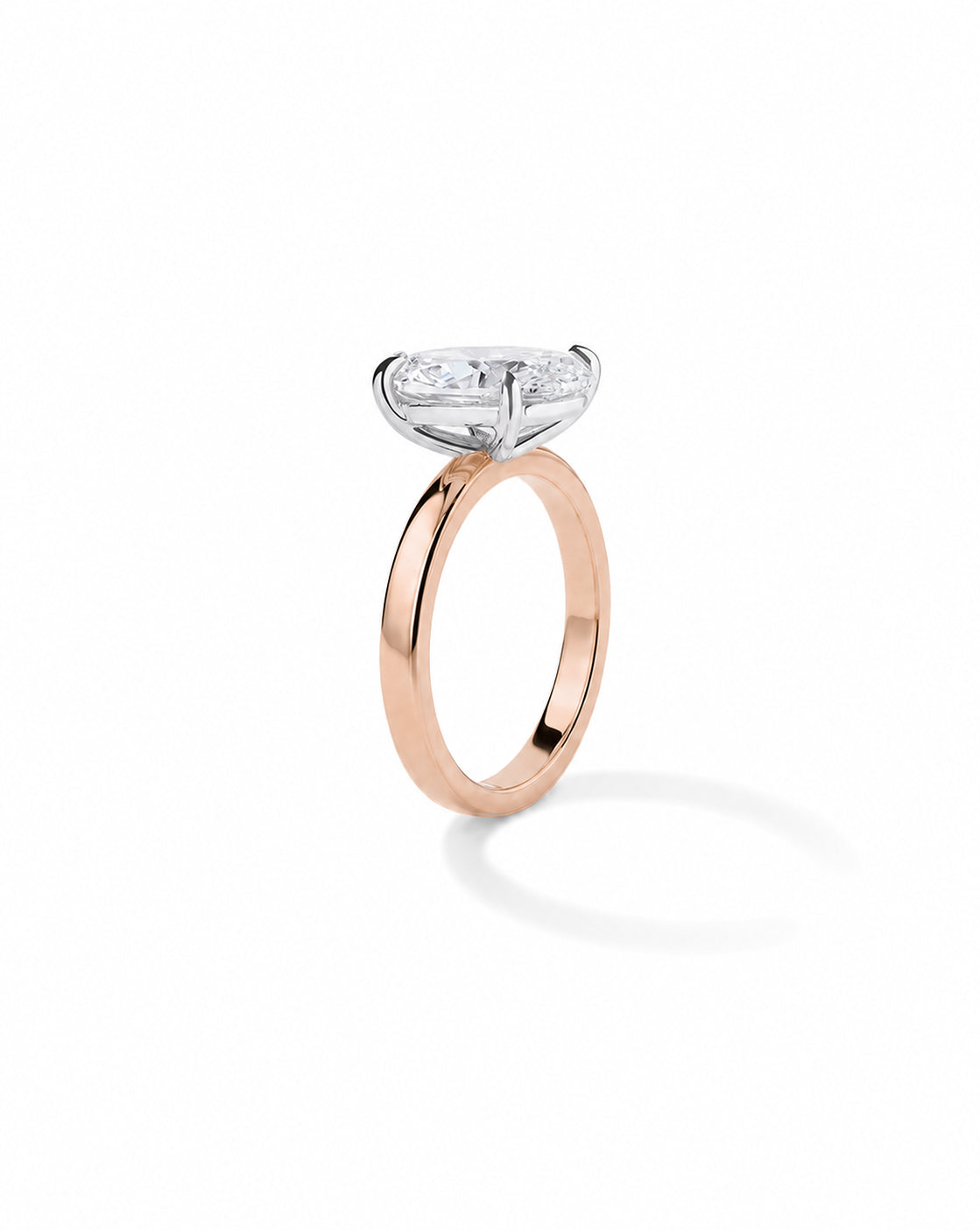 Rose gold engagement ring with a round diamond in a platinum four-prong setting, on a cigar-style band, shown on a white background. 44830238900312 