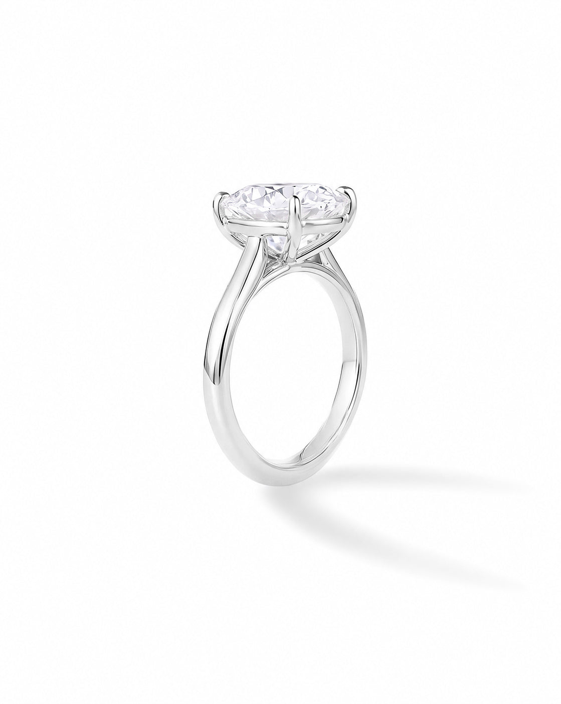 Side view of the Platinum cathedral engagement ring with cushion-cut diamond, on white background 50527014584408