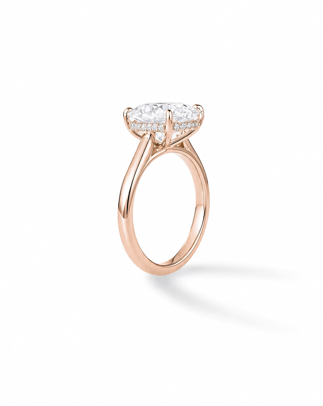Rose gold cathedral engagement ring with cushion-cut diamond and hidden halo, on white background 44836637605976 