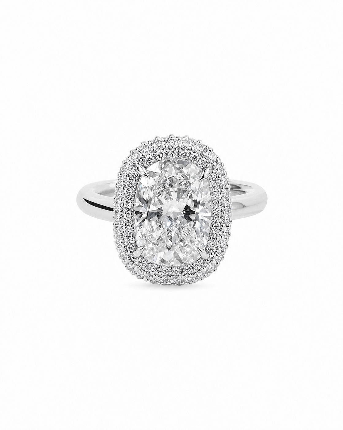 Platinum bridal ring featuring a cushion-cut center stone surrounded by a double pavé diamond halo, displayed on a white background 44830238736472