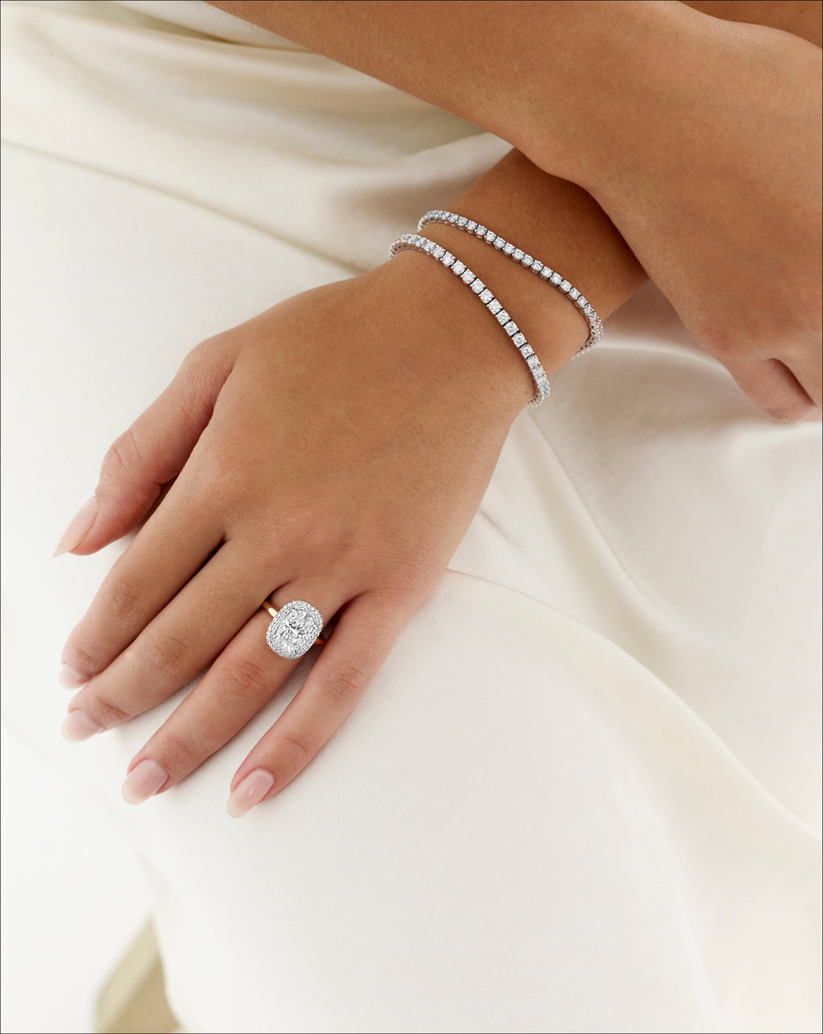 Cushion Cloud Bezel with Pavé Halo engagement ring shown on model  44830239424600 44830239031384 44830238736472