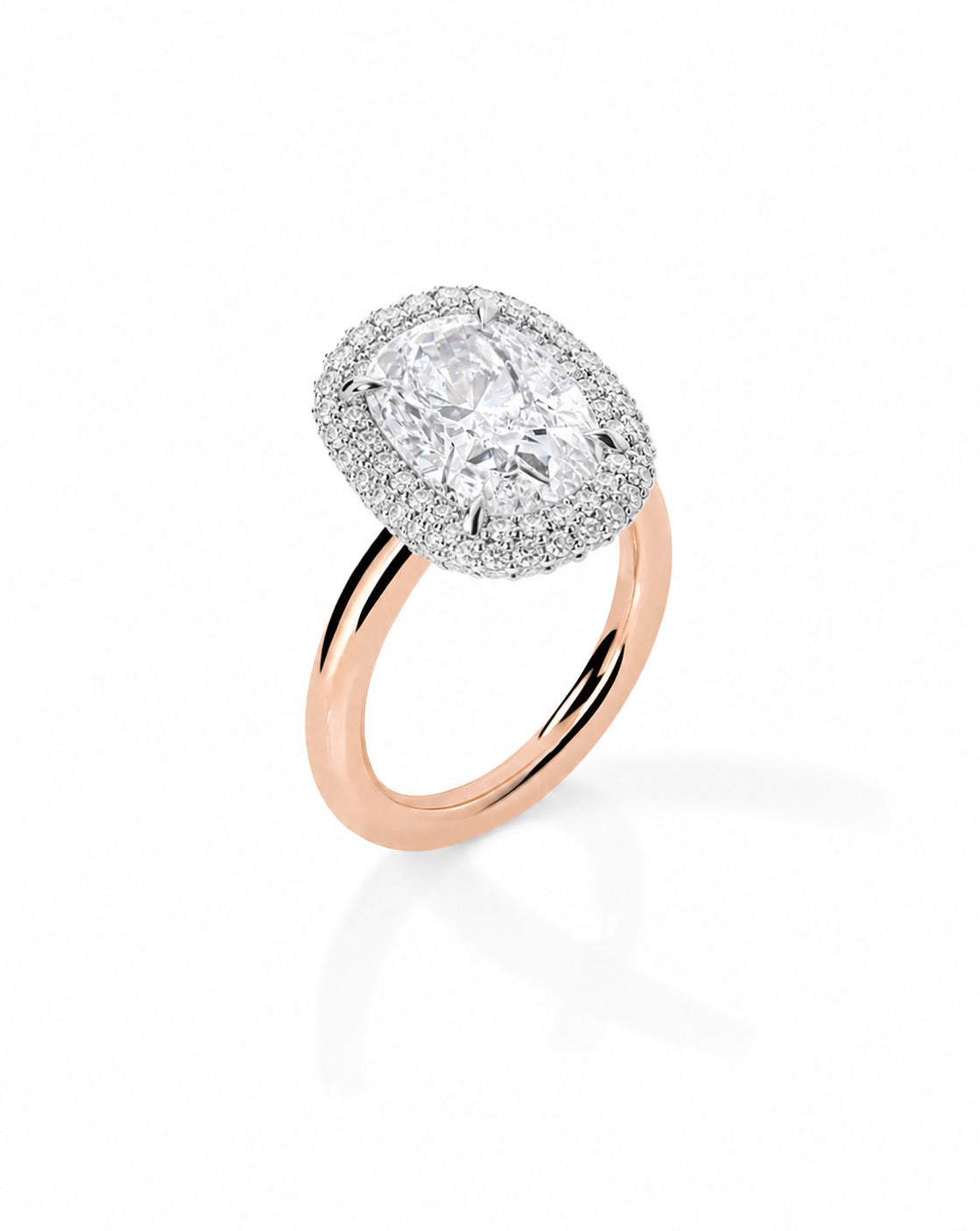 14k rose gold bridal ring featuring a cushion-cut center stone surrounded by a double pavé diamond halo, displayed on a white background 44830239031384