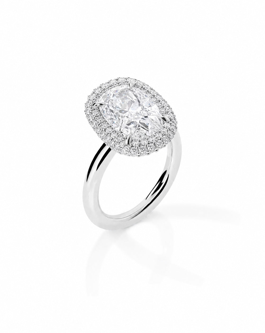 Platinum bridal ring featuring a cushion-cut center stone surrounded by a double pavé diamond halo, displayed on a white background 44830238736472