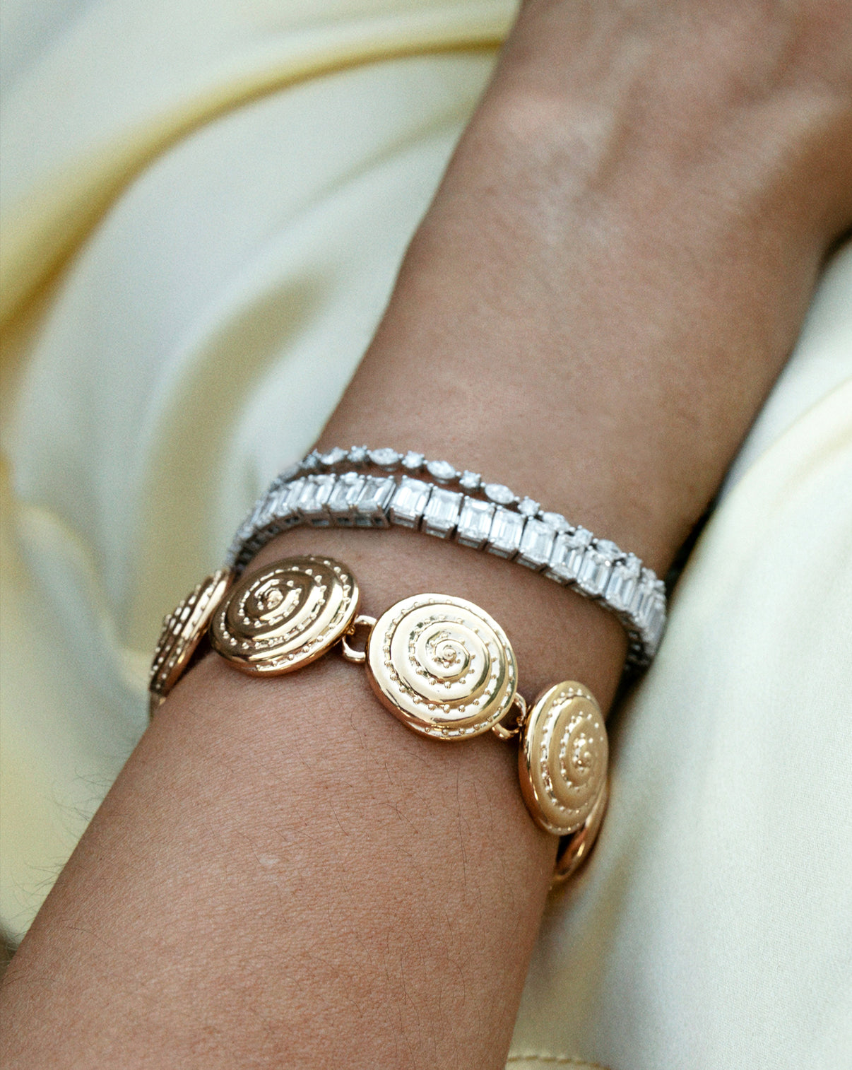 Spiral bracelet styled with tennis bracelets