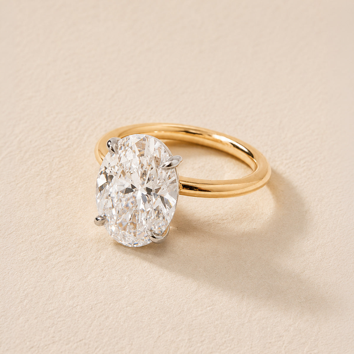 oval whisper thin engagement ring on 14k yellow gold band