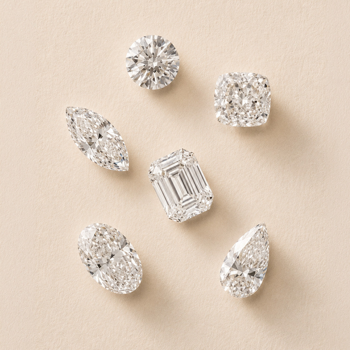 still life image of different diamond shapes: round, cushion, marquise, emerald, oval, pear