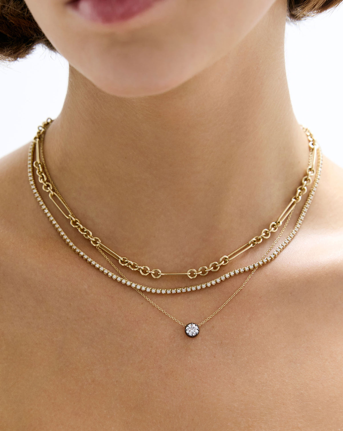 Detailed view of 14k gold Georgian lab diamond pendant necklace worn on neck showing diamond and gold chain