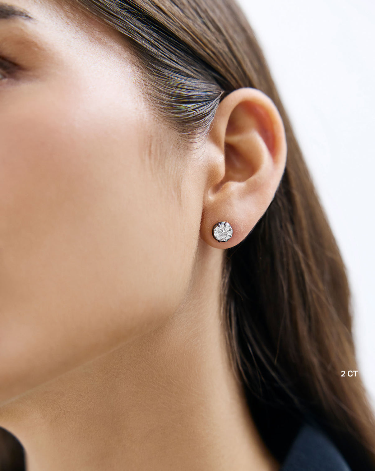 Georgian lab diamond stud earrings worn on ear showing size and details Global