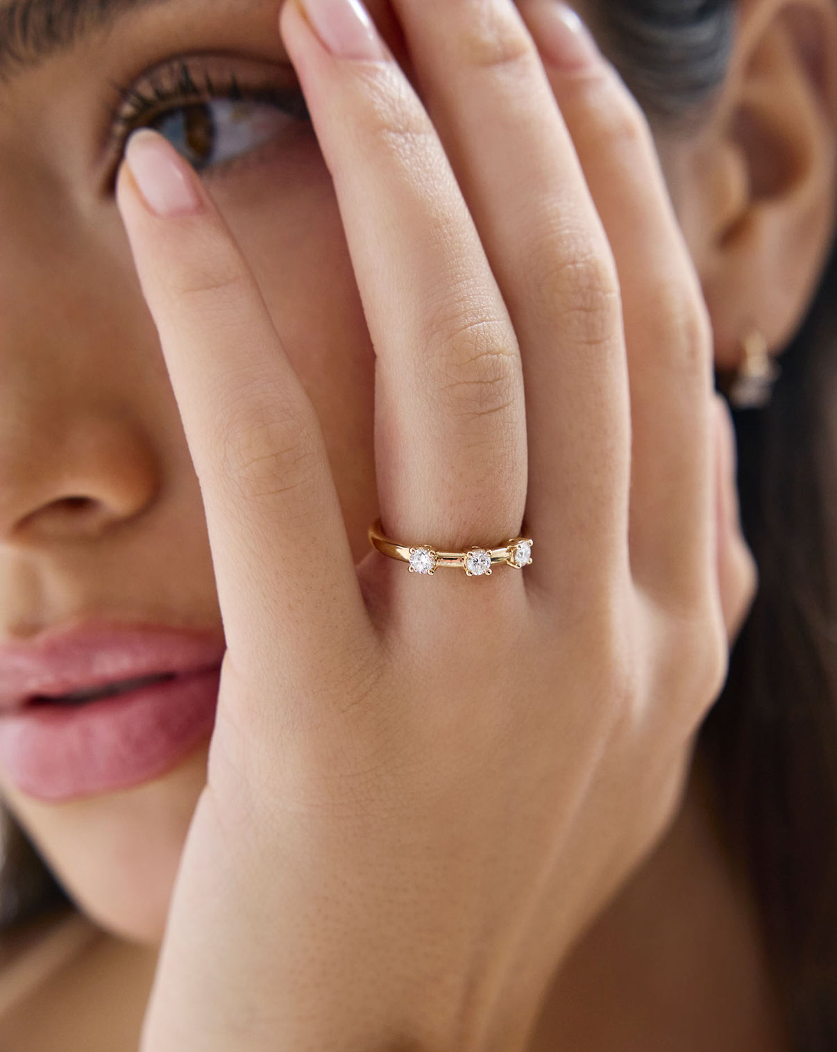 Close up view of model wearing Lab Diamond Trio Wedding Band GLOBAL