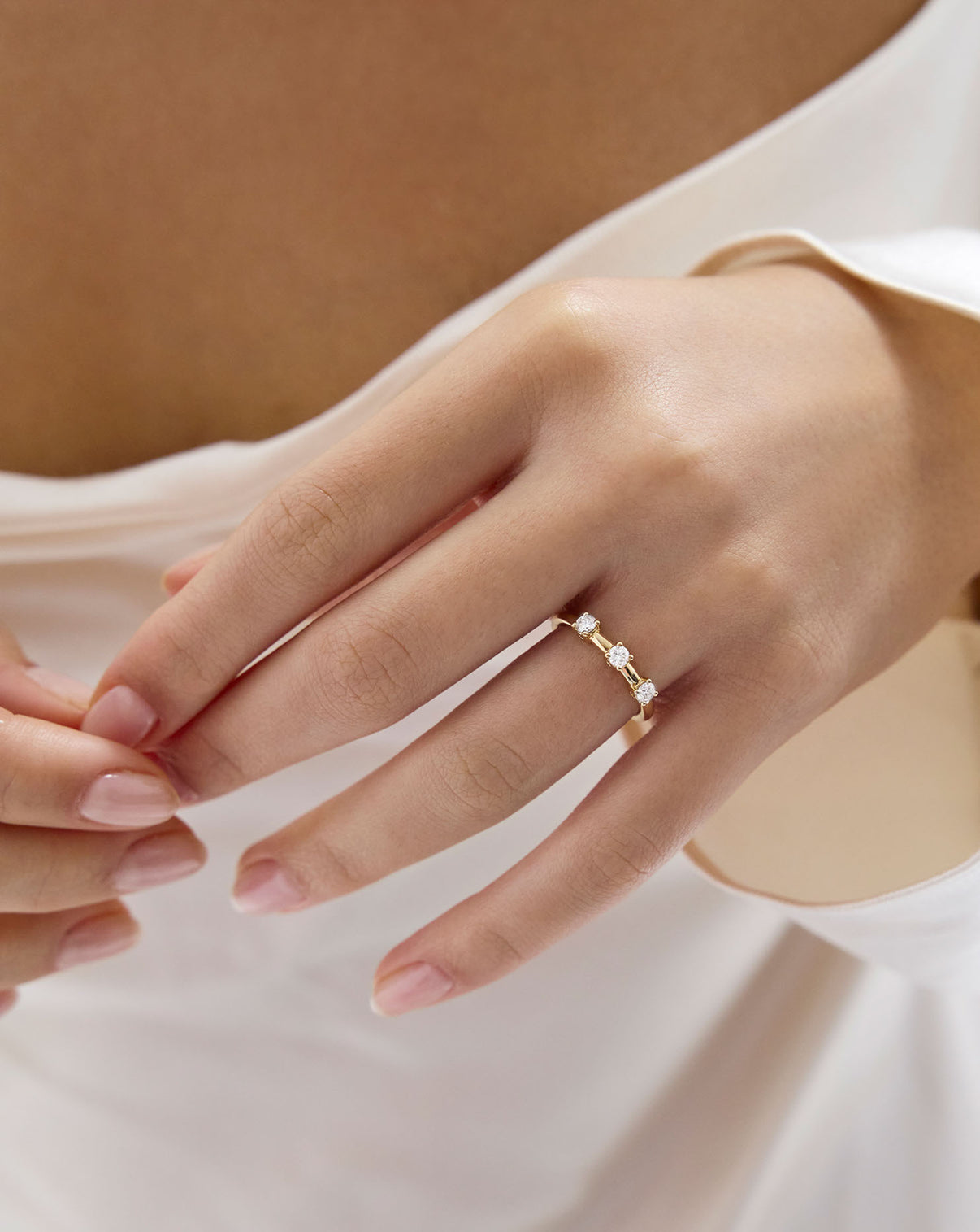 Natural Diamond Trio Wedding Band being worn on finger by model GLOBAL