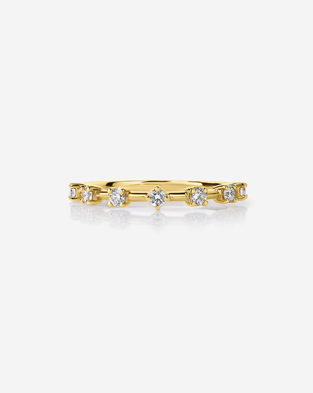 14k Yellow Gold Diamond Station Wedding Band with 7 round natural diamonds.