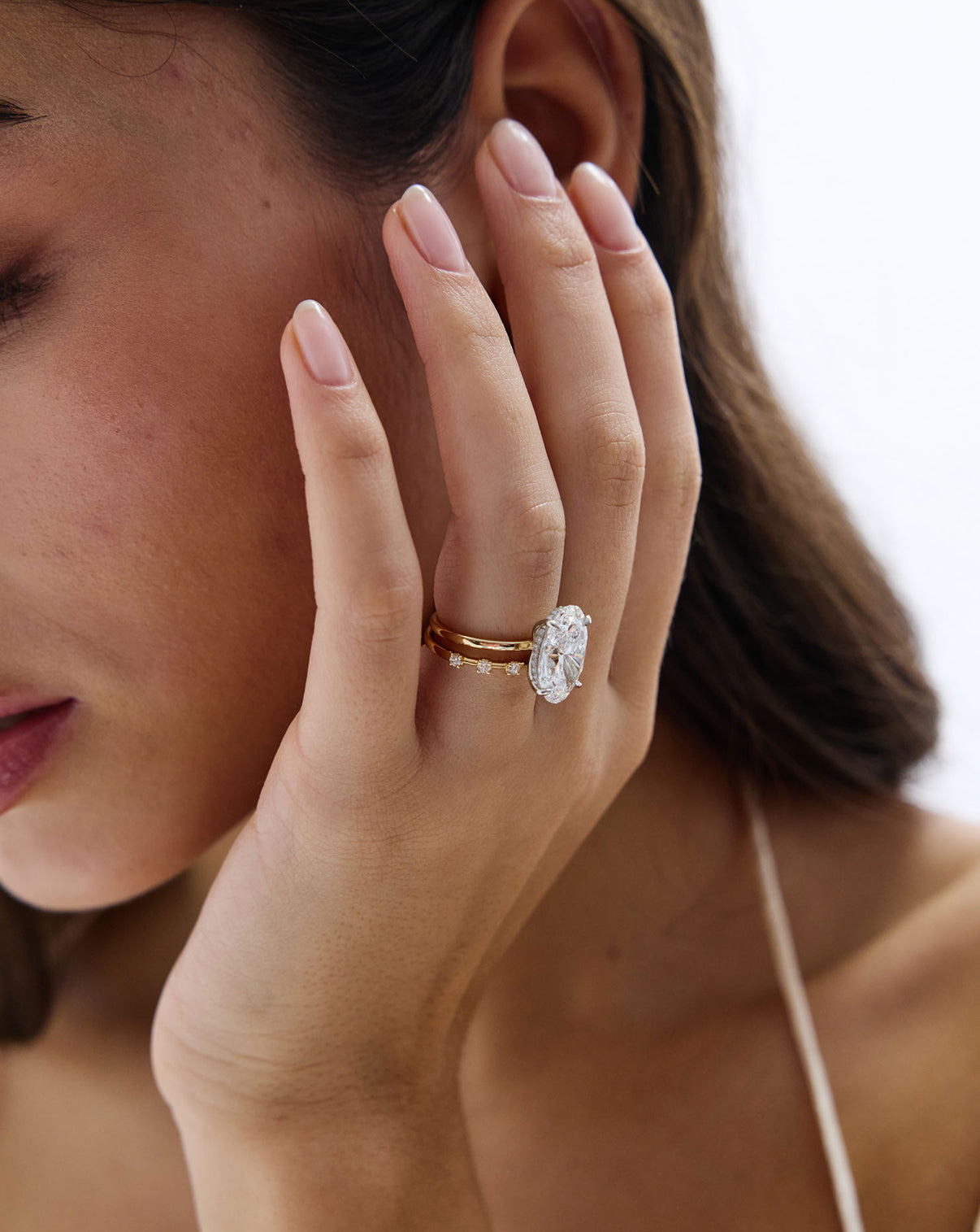 Model wearing 7 Stone Lab Diamond Station Wedding Band stacked with diamond ring GLOBAL