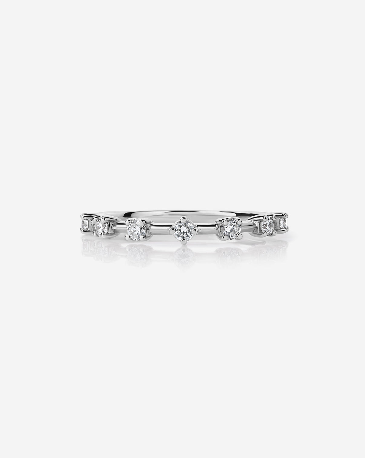 Platinum Diamond Station Wedding Band with 7 round lab diamonds.