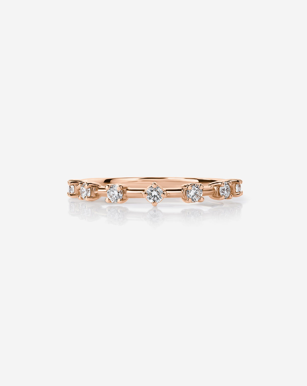 14k Rose Gold Diamond Station Wedding Band with 7 round natural diamonds.