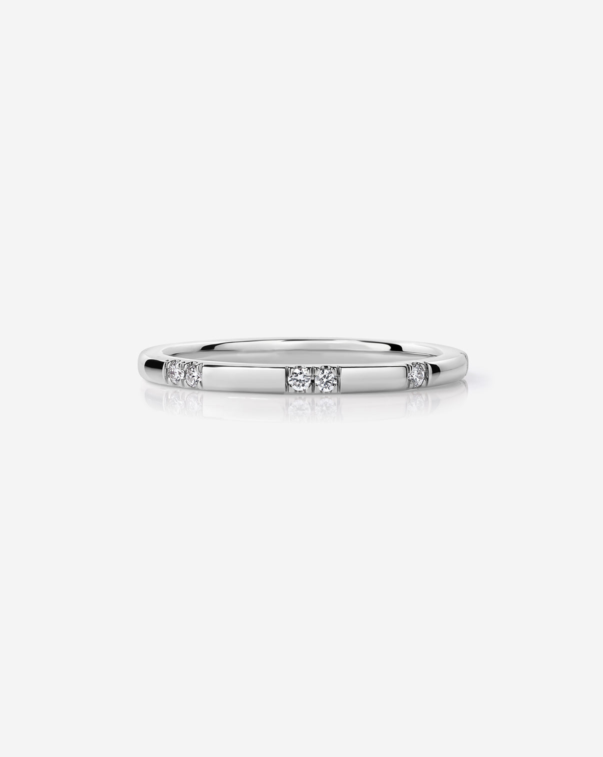 Platinum Scattered Diamond Wedding Band with 12 round natural diamonds.
