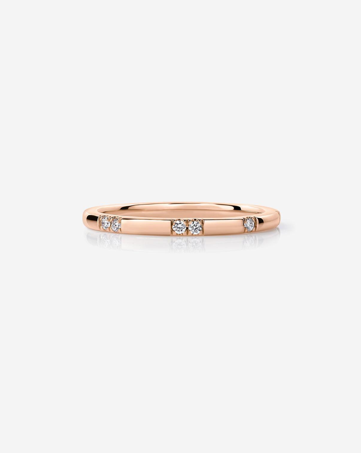 14k Rose Gold Scattered Diamond Wedding Band with 12 round natural diamonds.