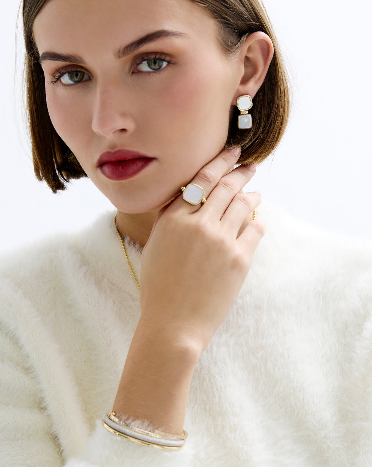 Model wearing swivel pearl + pavé ring paired with our square pearl earrings.