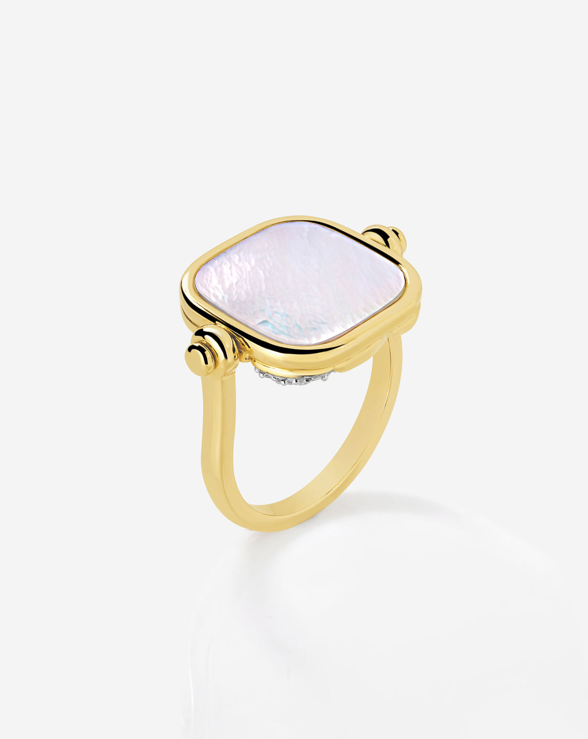 Close up top angled view of swivel pearl + pavé ring showcasing luminous pearl side.