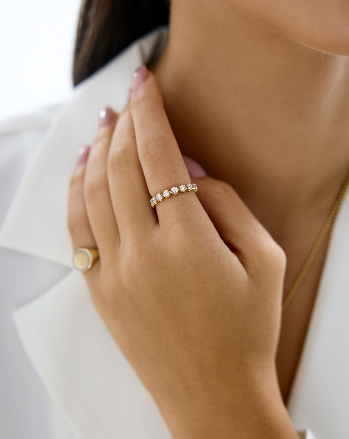 Model wearing pave band in yellow gold GLOBAL