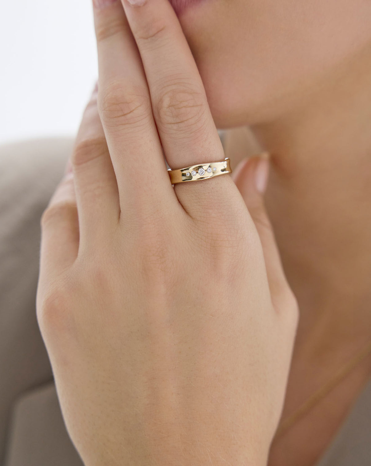 Side view of Organic Shapes Diamond Row Ring worn on finger showing 14k gold setting and band details