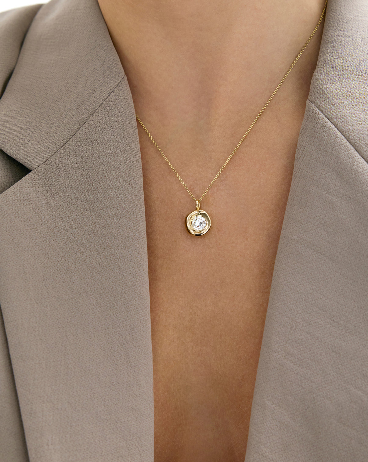 Close-up of Organic Shapes Pendant Necklace worn around model's neck