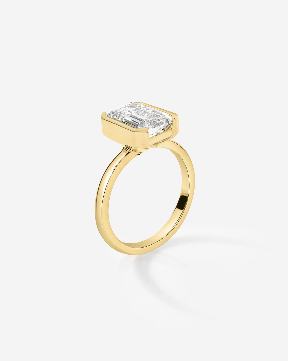 3 carat Emerald Diamond Engagement Ring in The Edge Yellow Gold Half Bezel side view