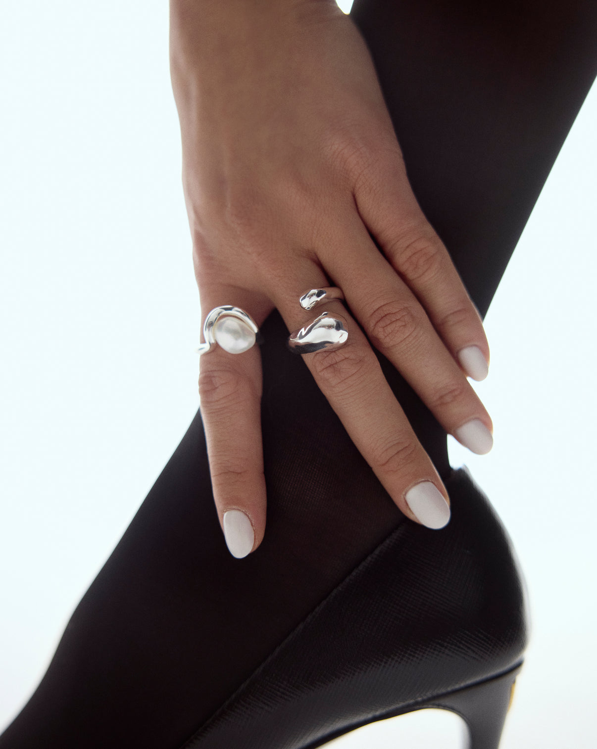 Side view of curved wrap ring highlighting the unique wraparound silhouette