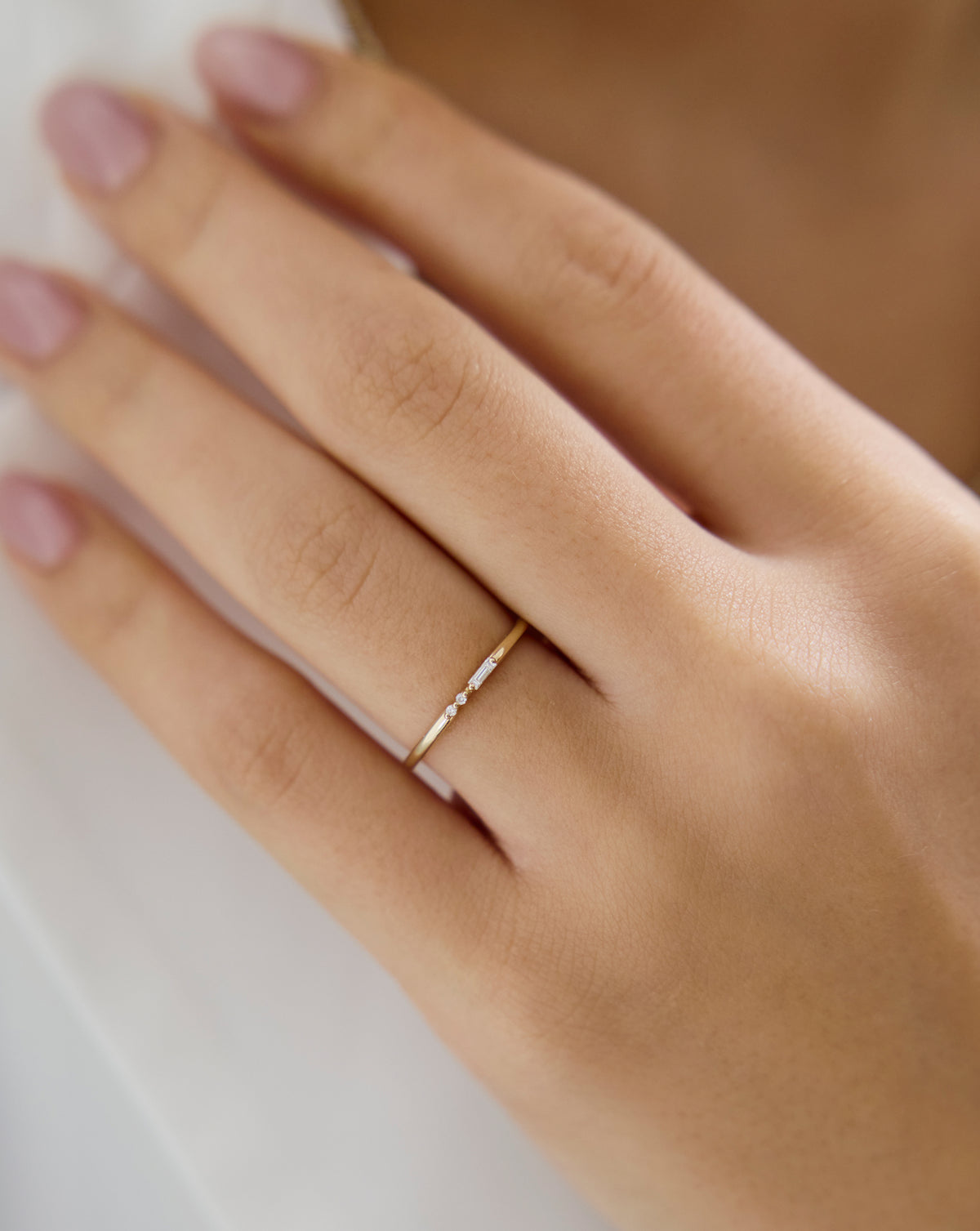 Woman wearing Ring Concierge Baguette + Round Diamond Ring from the Holiday Collection, perfect for elegant holiday celebrations
