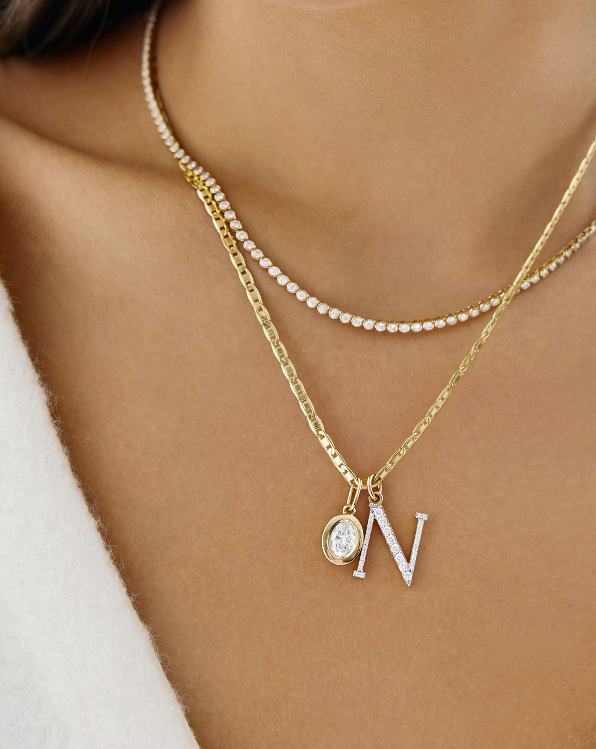 on-model video of chain necklace styled with more necklaces