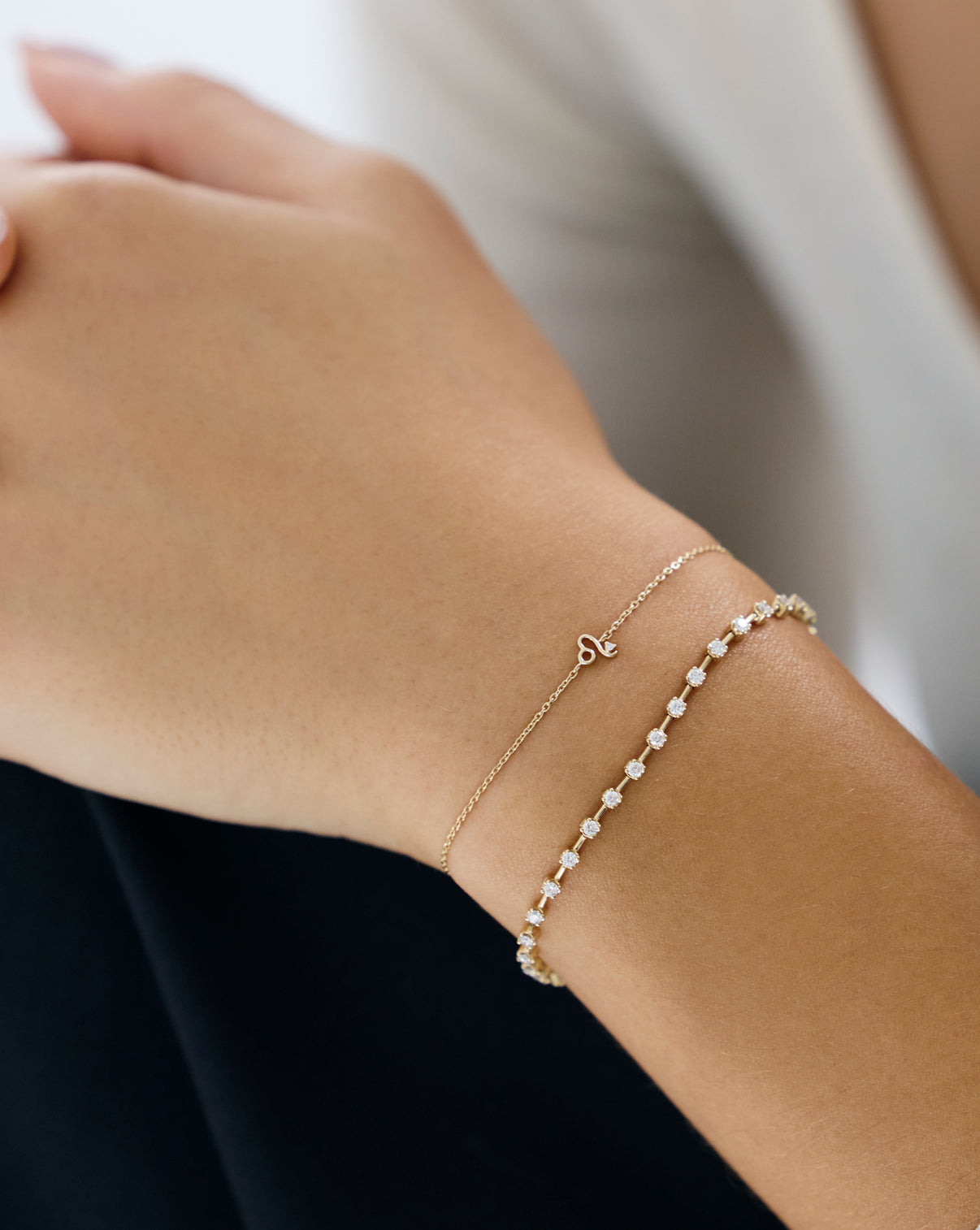 Ring Concierge Zodiac Bracelet Holiday Collection - Close-up detail of zodiac constellation charm with sparkling diamonds on gold bracelet