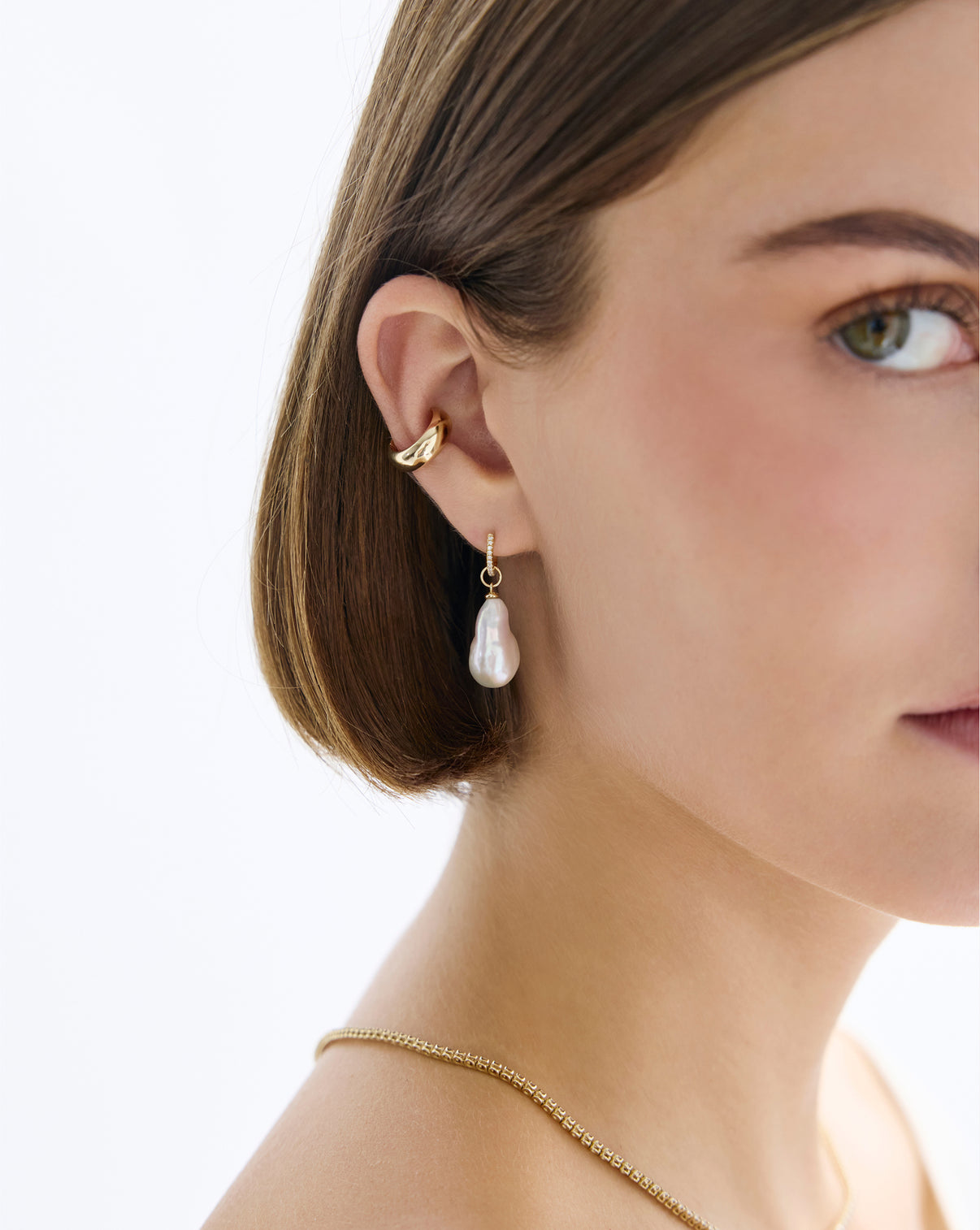 Pearl Huggie Charms by Ring Concierge - Holiday Collection pearl styled with huggie earring detail shot