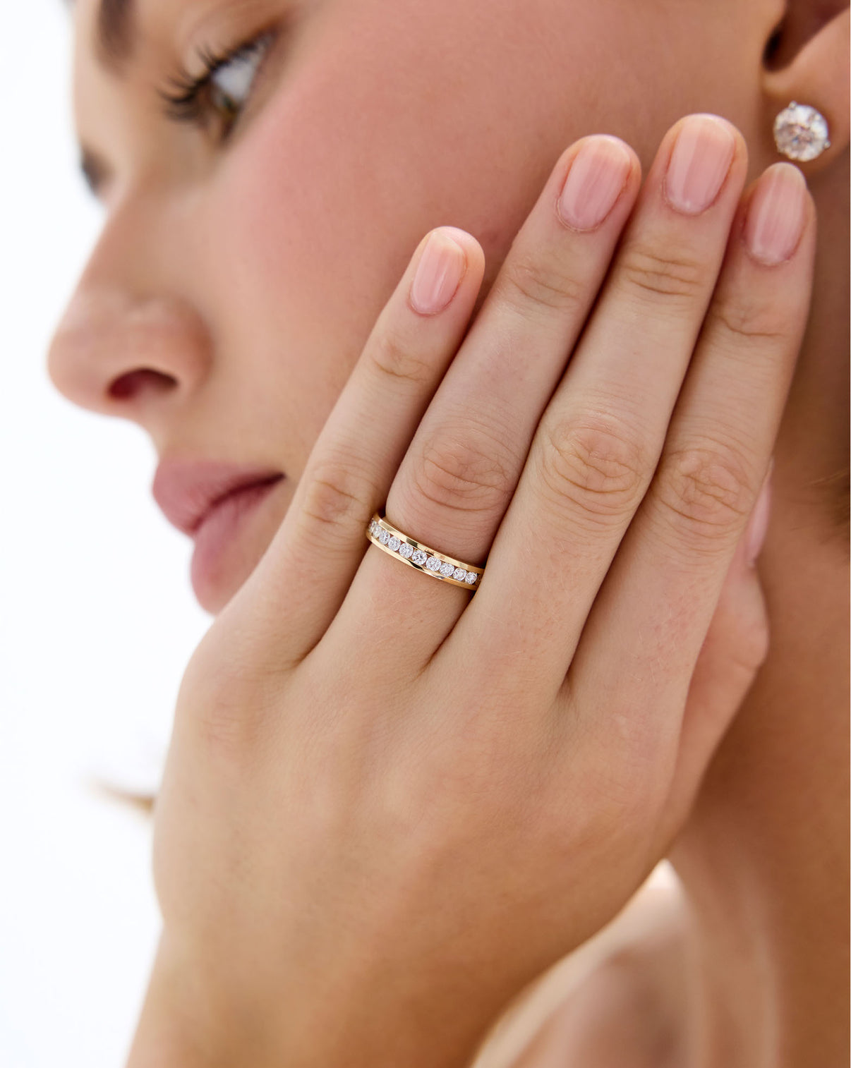 model wearing Round Diamond Channel Set Band ring in 14K Yellow Gold
