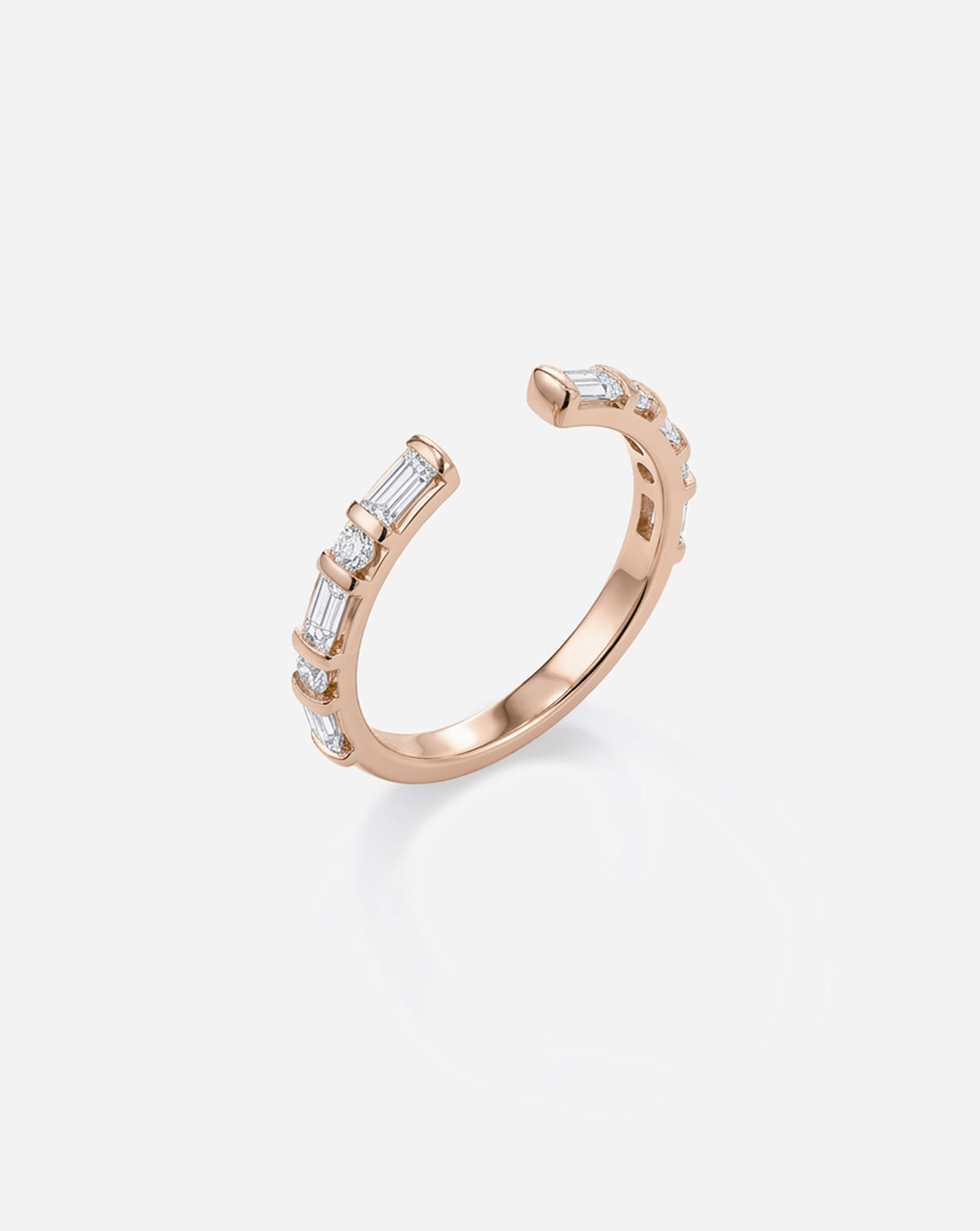 Angled side view of the Baguette + Round Open Lab Diamond Band in 14k rose gold, highlighting its open silhouette and alternating baguette and round lab diamonds. 14k Rose Gold