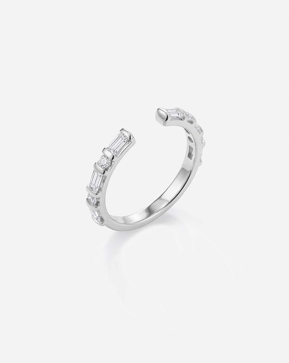 Angled side view of the Baguette + Round Open Lab Diamond Band in platinum, highlighting its delicate silhouette and alternating baguette and round lab diamonds. Platinum 
