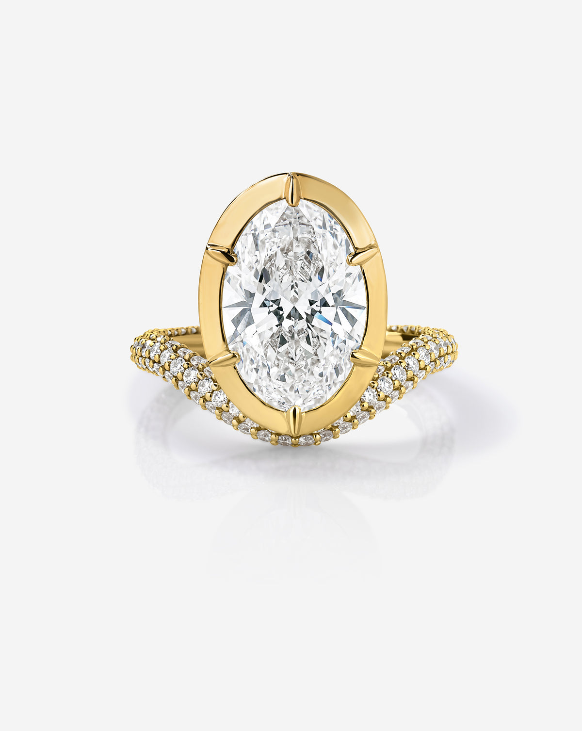 Front view of the Pavé Nest ring featuring a 3.08-carat oval lab-grown diamond in a 14k yellow gold setting, framed by a curved, double-row diamond pavé band.