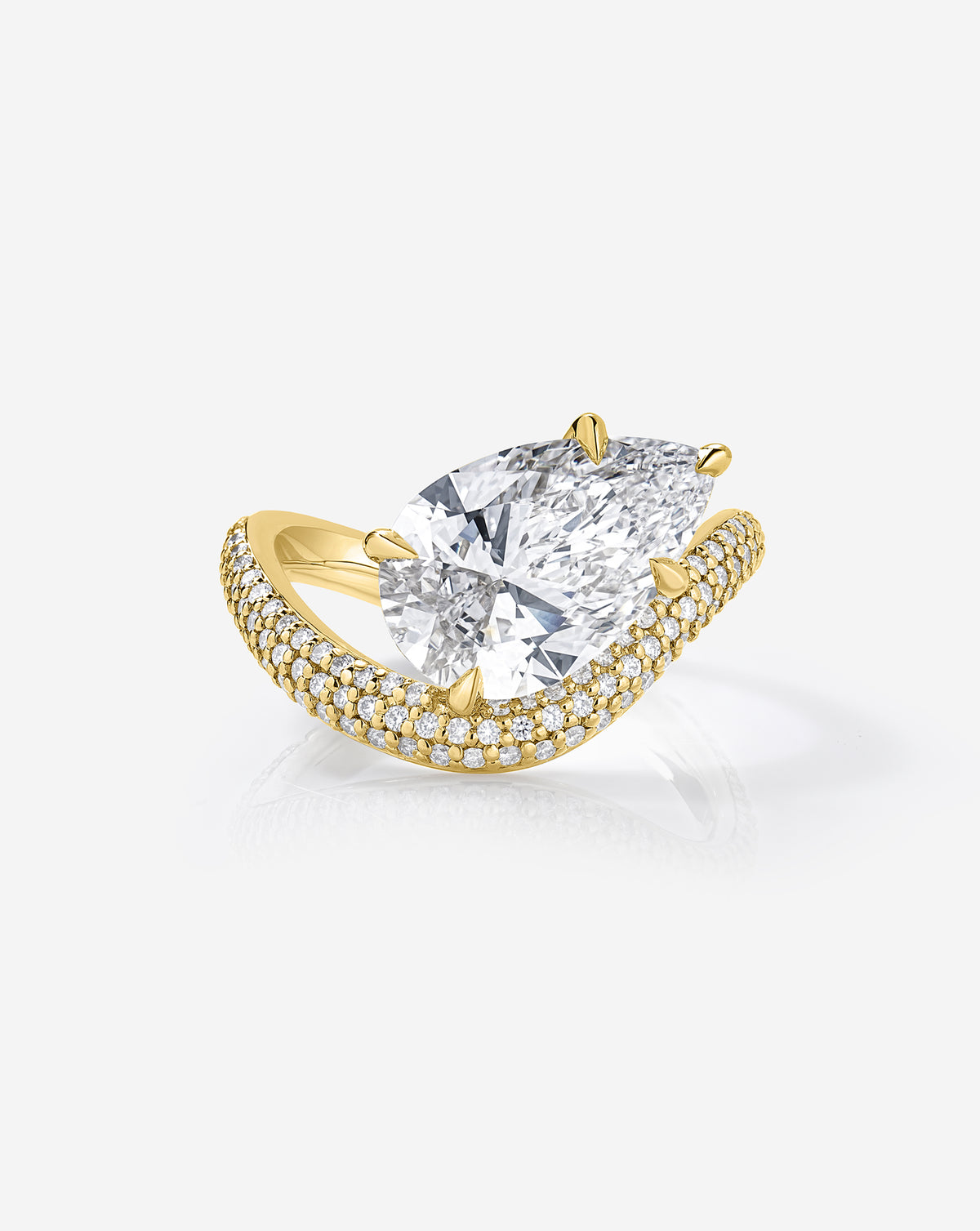Front view of the Pavé Wave ring featuring a 3.02-carat pear-shaped lab-grown diamond in a prong setting above a curved, diamond pavé 14k yellow gold band.