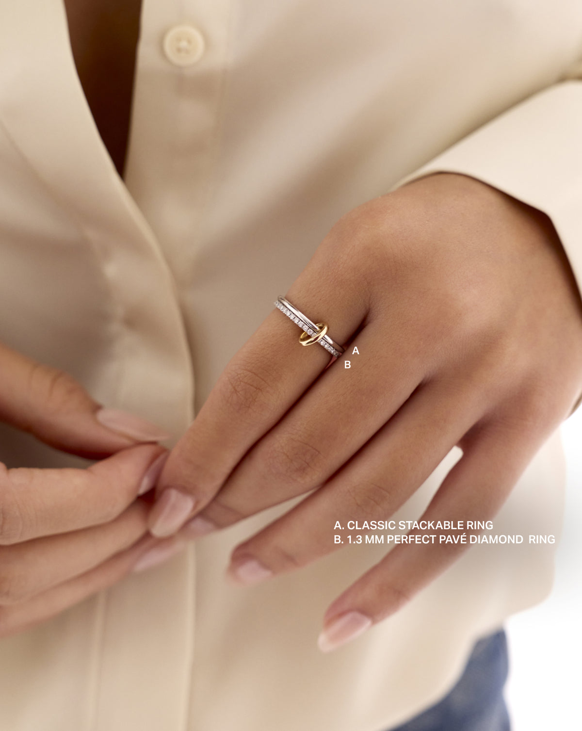 Model wearing a stacked Classic Stackable Ring and 1.3 MM Perfect Pave Diamond Ring being connected by the 14k Yellow Gold Ring Clique Clasp 14k Yellow Gold Sterling silver