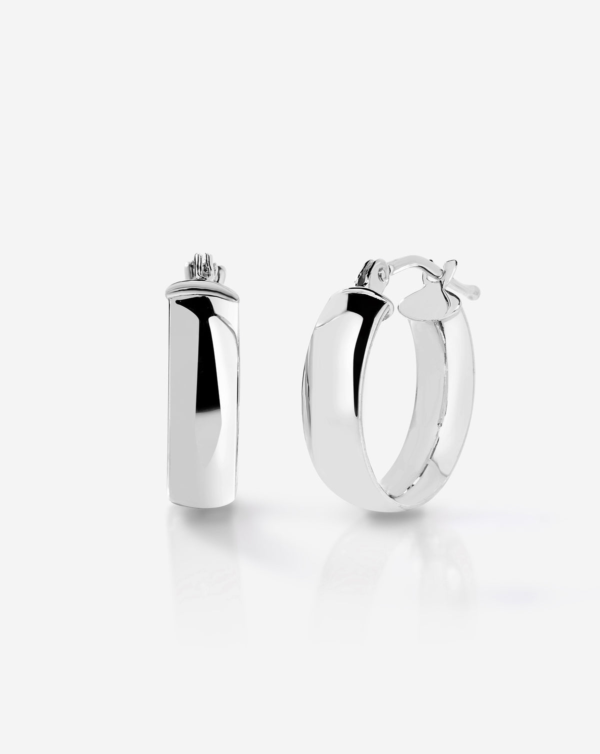 Sterling silver wide mini hoop earrings with a smooth rounded design and hinged closure, displayed on a white background.