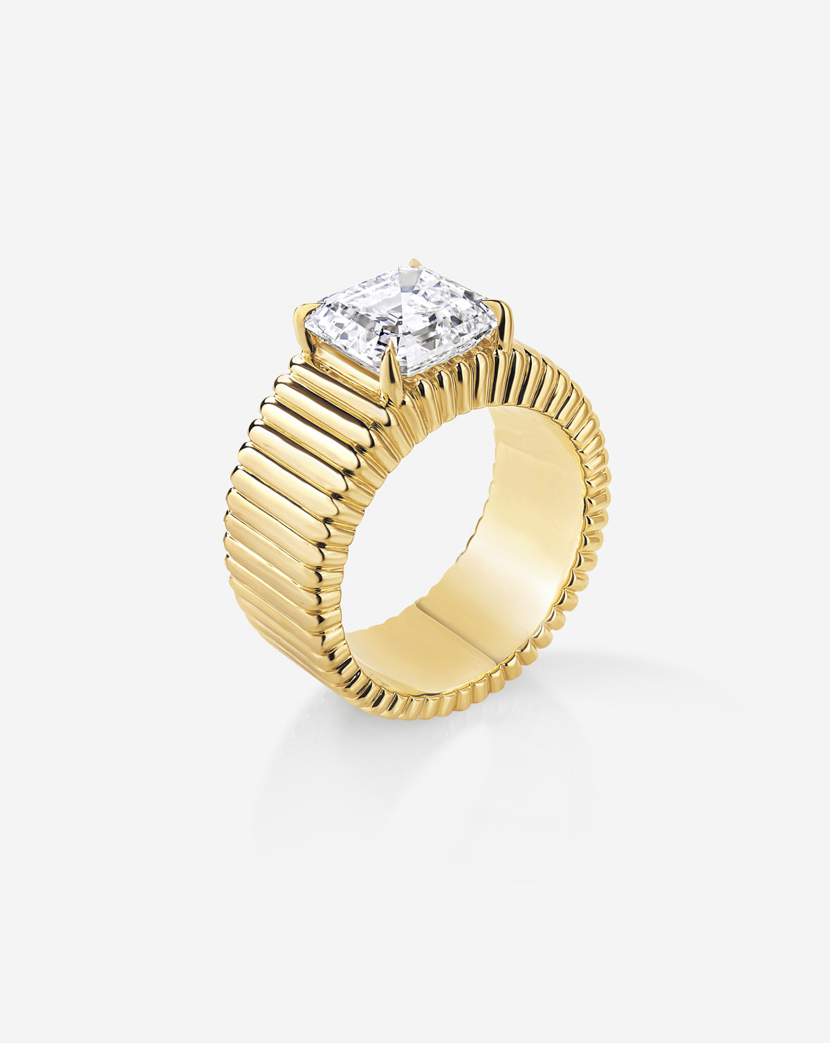 Angled side view of the Ribbon ring featuring a 2.85-carat Asscher-cut lab-grown diamond in a raised four-prong setting above a wide, fluted yellow gold band.