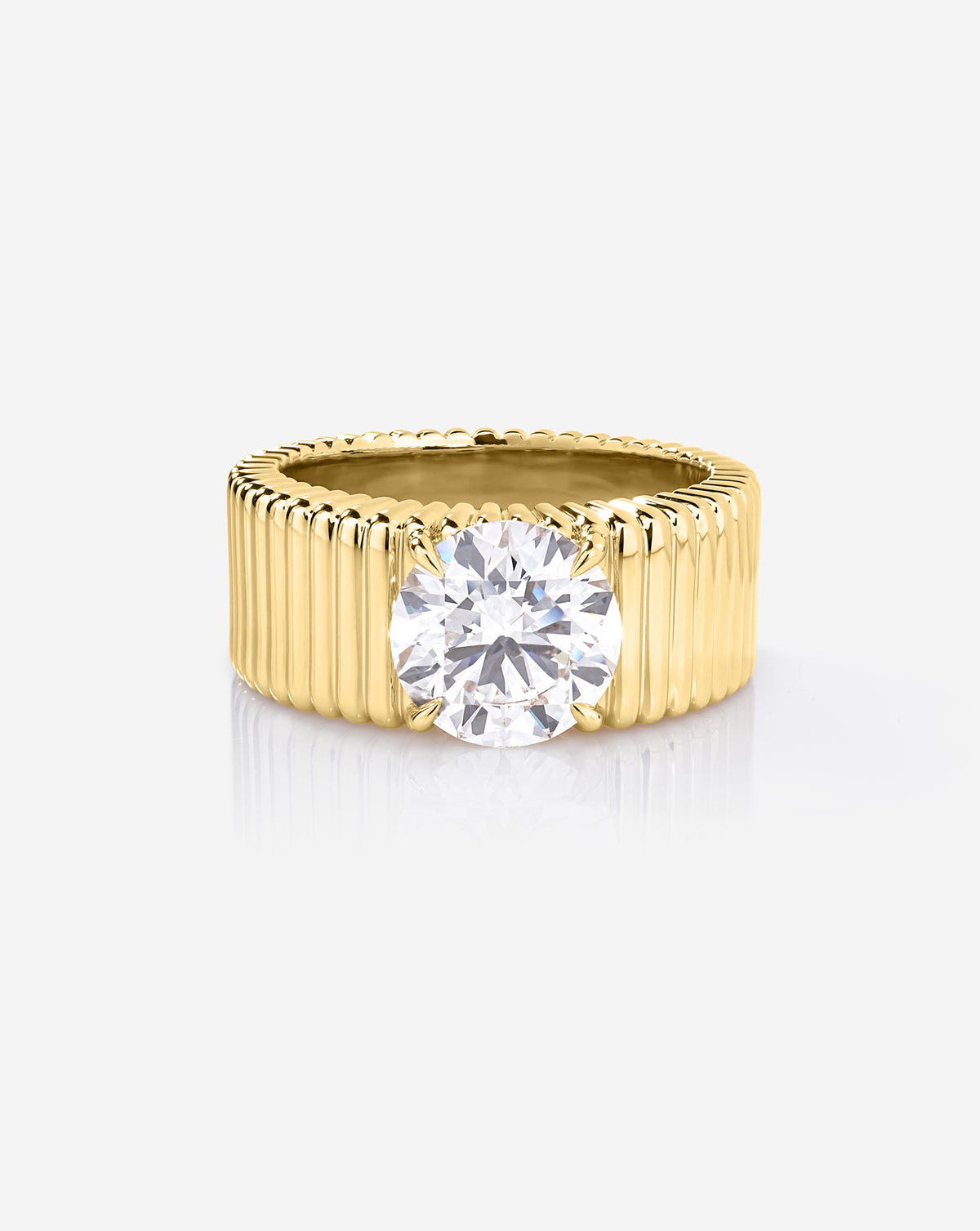 Front view of the Ribbon ring featuring a 2.00-carat round lab-grown diamond in a four-prong setting on a wide, fluted yellow gold band.