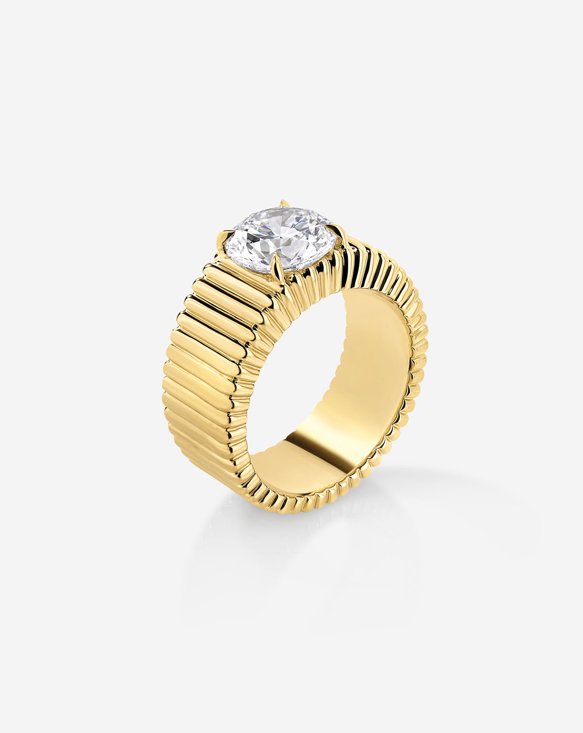 Angled side view of the Ribbon ring showing a 2.00-carat round lab-grown diamond in a raised four-prong setting above a wide, fluted yellow gold band.